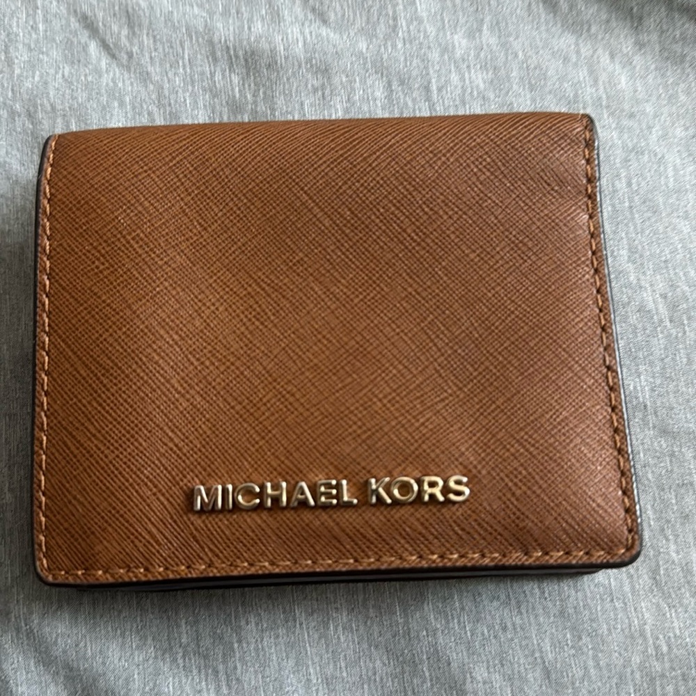 Michael Kors wallet never used with a tiny black mark on the back